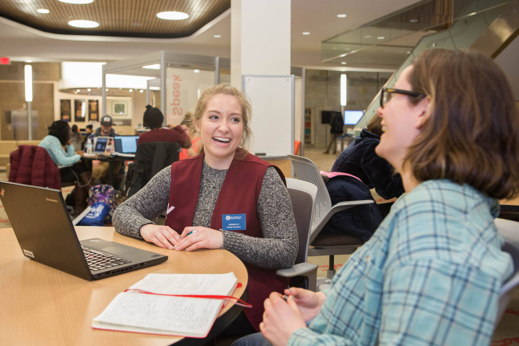 student talking to someone at the knowledge market
